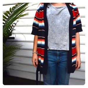 • Bright fall-colored cardigan •